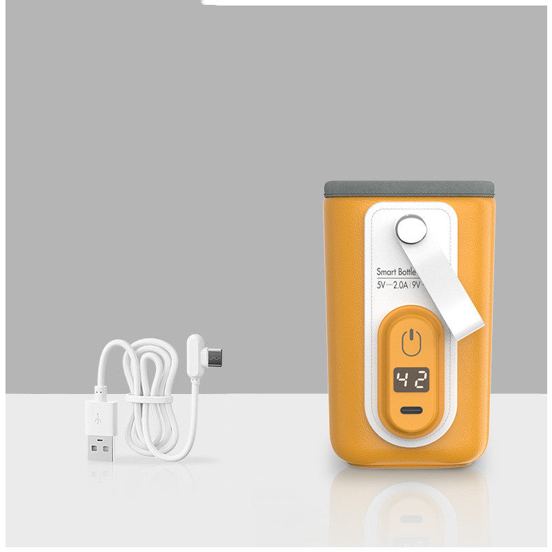 Orange portable USB baby bottle warmer with digital display and white charging cable.