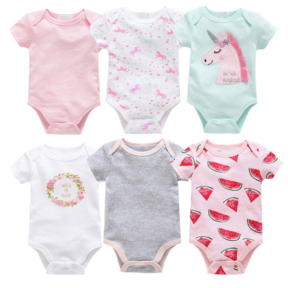 Six short-sleeve cotton baby bodysuits in pink, white, grey, and mint with unicorn, floral, and watermelon prints.