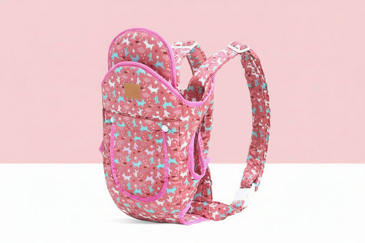 Pink ergonomic baby carrier with white and blue animal print, adjustable straps, and front pocket.