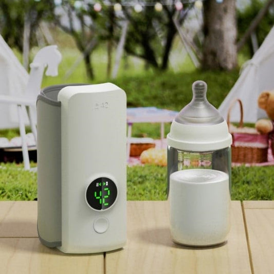 Portable USB rechargeable baby bottle warmer with smart temperature control and a bottle, outdoors.