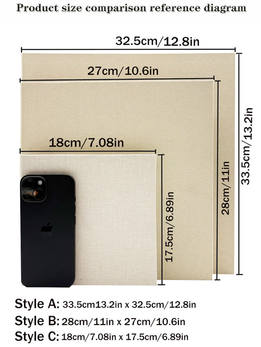 Three beige linen photo albums in varying sizes, with a black smartphone for scale.