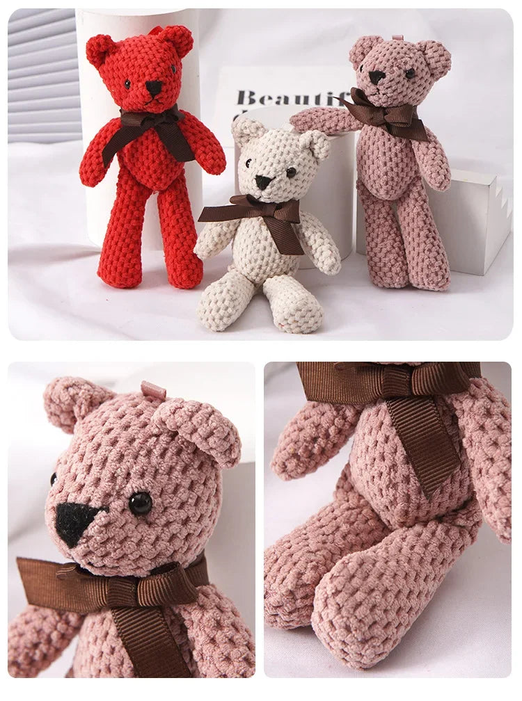 Three knitted teddy bears in red, cream, and pink with brown bows, 16cm tall.