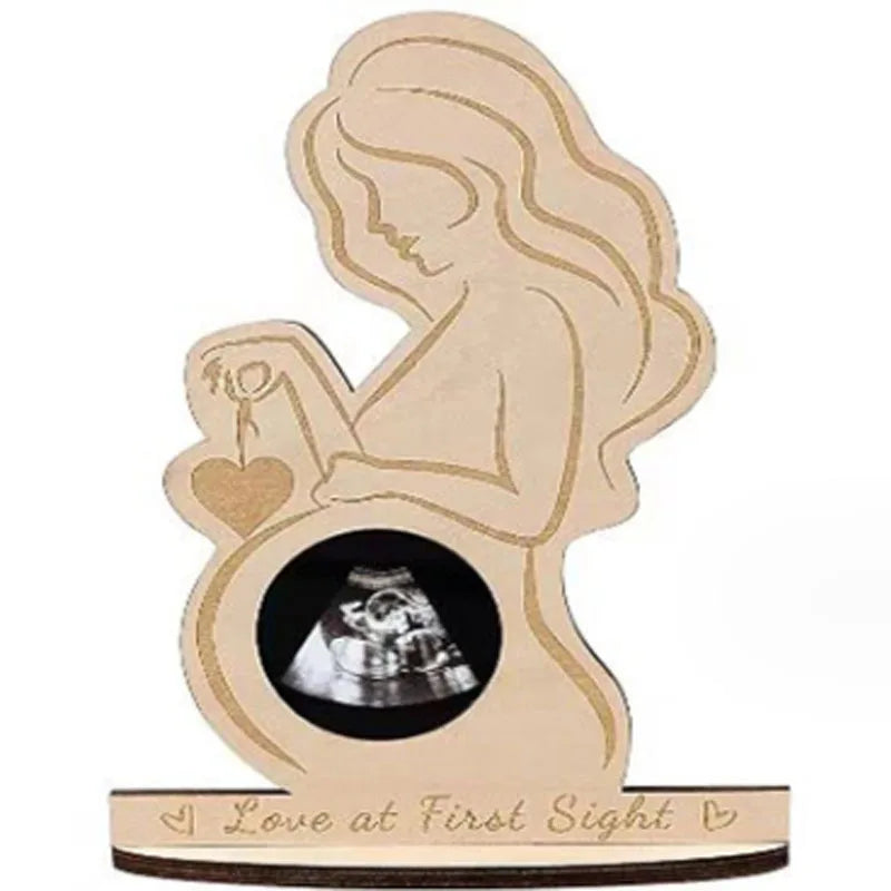 Wooden pregnancy keepsake with a mother silhouette, heart, and ultrasound photo insert, reading "Love at First Sight.