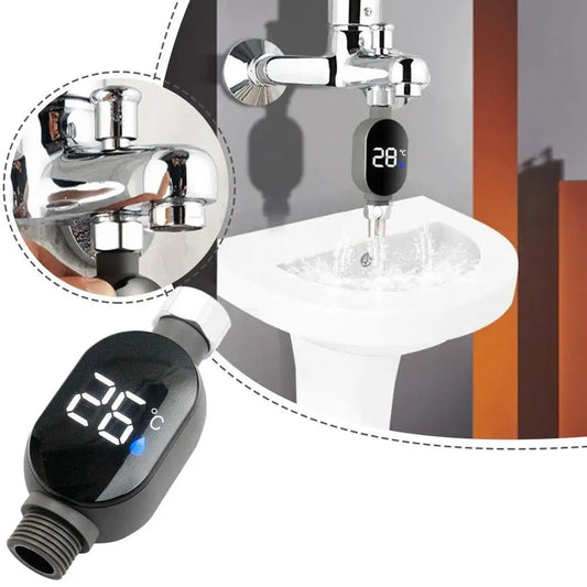Black digital shower thermometer with LED display showing 26°C, attached to a chrome faucet.