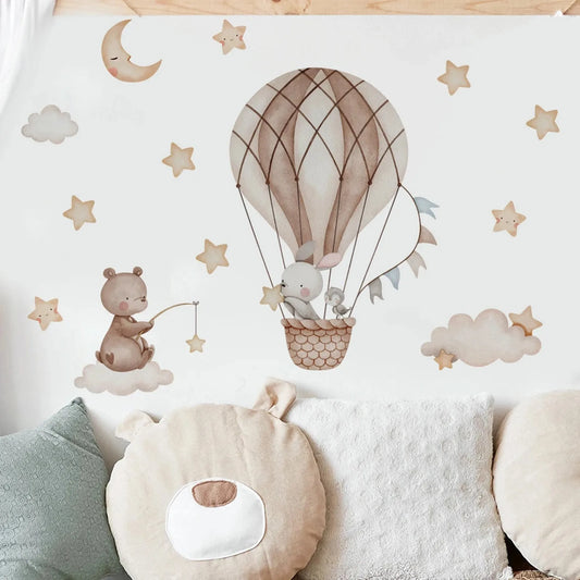 Whimsical bear and bunny hot air balloon wall decals with stars, moon, and clouds for a nursery.