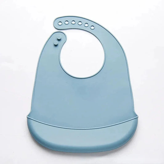 Light blue waterproof silicone baby bib with adjustable neck closure and food-catching pocket.