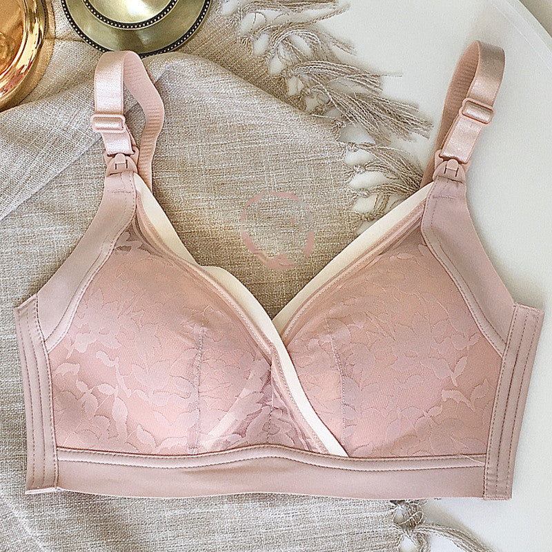 Seamless nude maternity and nursing bra with delicate jacquard floral pattern and adjustable straps.
