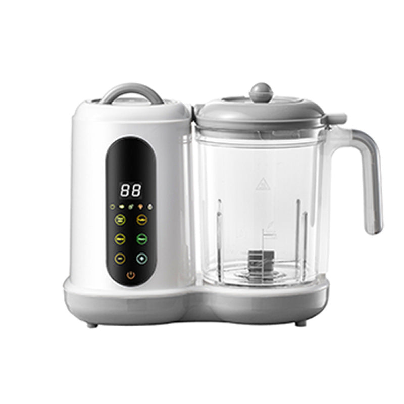 White and gray automatic baby food maker with digital display, steaming, and blending functions.