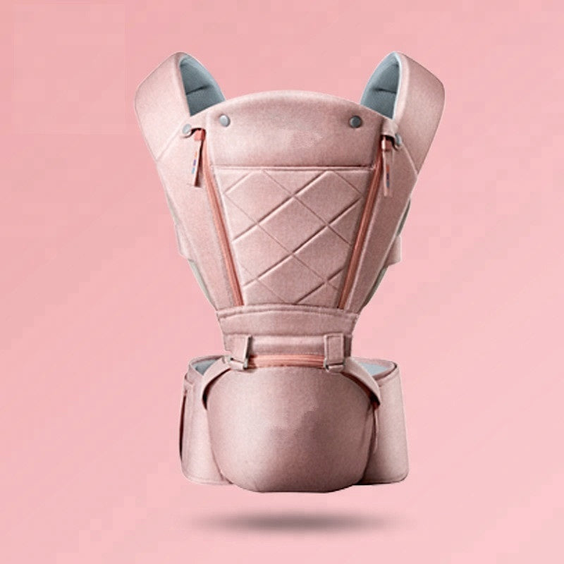 Pink ergonomic hip seat baby carrier with breathable fabric and quilted design.