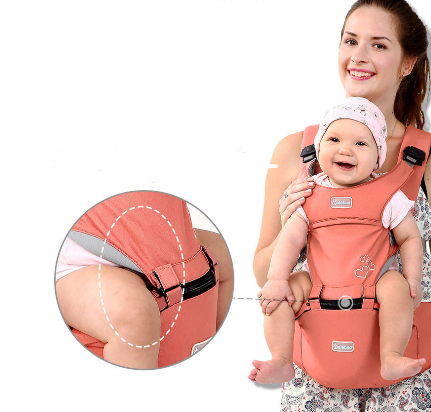 Smiling mother carrying a happy baby in an ergonomic peach-colored baby carrier with a supportive hip seat.