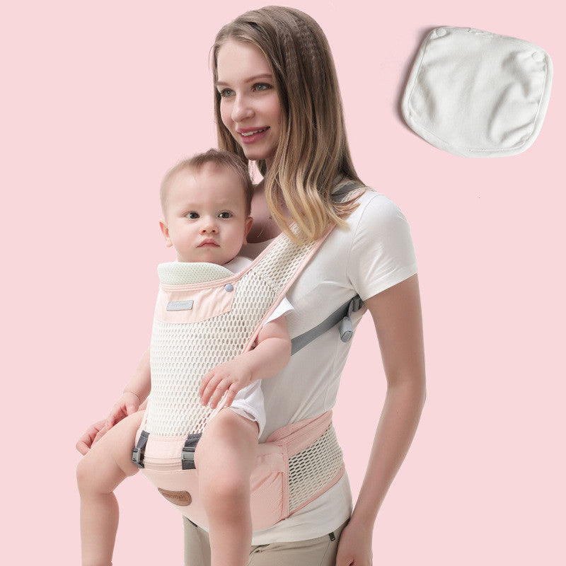 Woman carrying baby in a pink ergonomic hip seat carrier with breathable mesh, plus a white burp cloth.