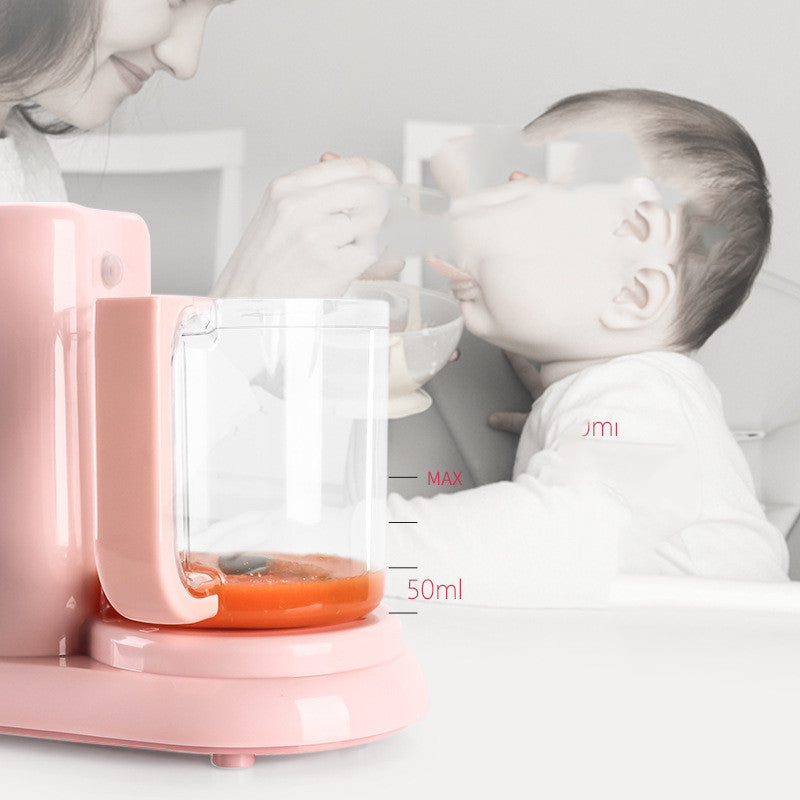 Pink baby food steamer and blender, 25cm, with pureed food in a clear container.