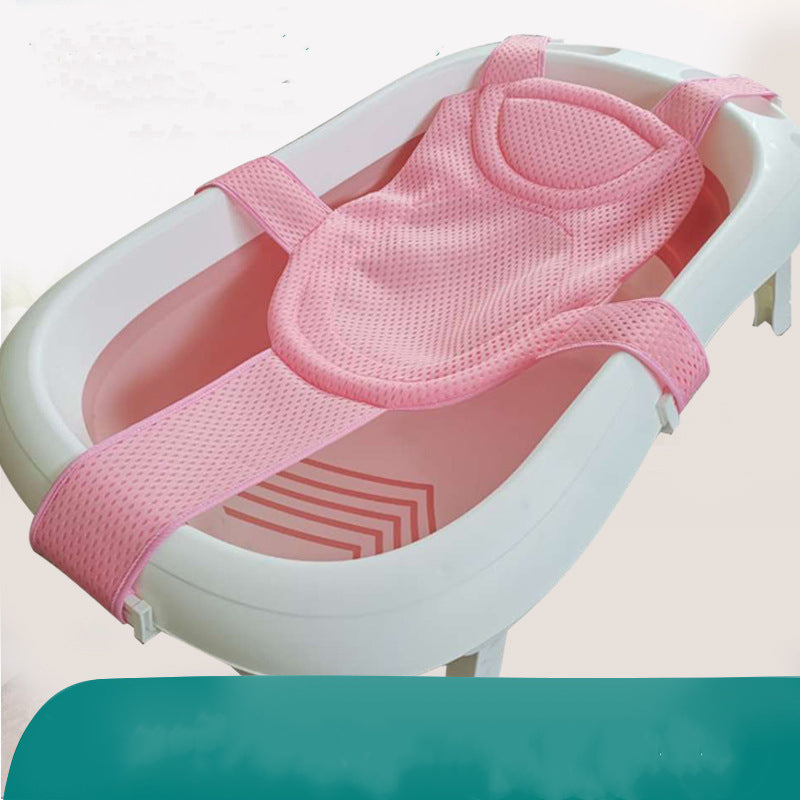 Pink mesh baby bath support sling in a white infant bathtub.
