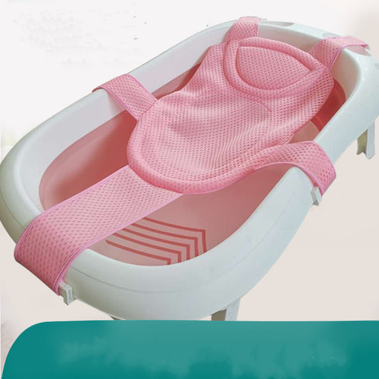 Pink mesh baby bath support sling in a white infant bathtub.
