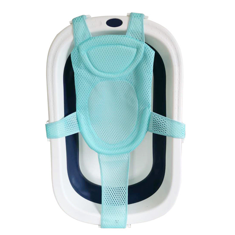 Aqua mesh baby bath support sling in a white and navy folding tub.