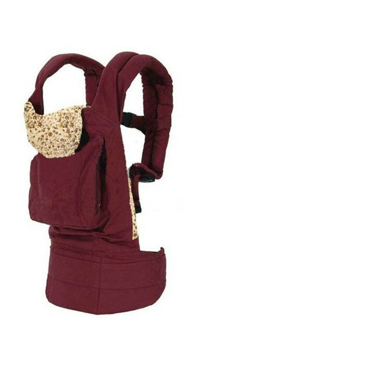 Ergonomic maroon cotton baby carrier with a beige patterned hood and padded straps.