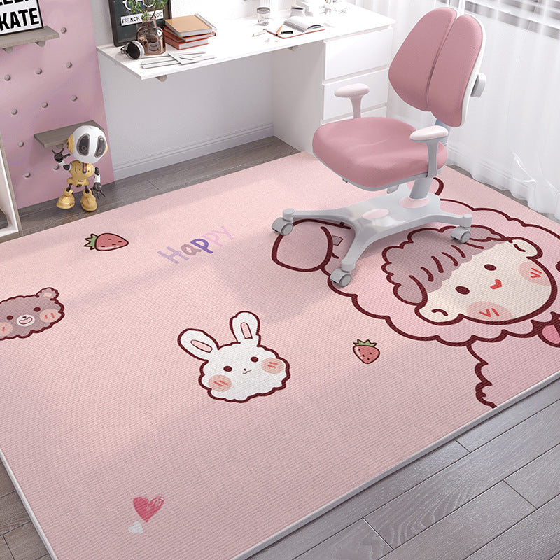 Pink crystal velvet kids' rug with cute cartoon animals, strawberries, and "Happy" text, under a pink desk chair.