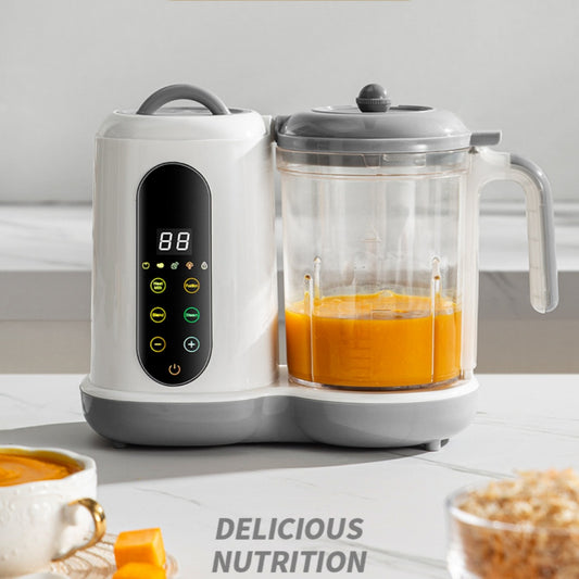 White and gray automatic baby food maker with a clear blending pitcher containing orange puree.