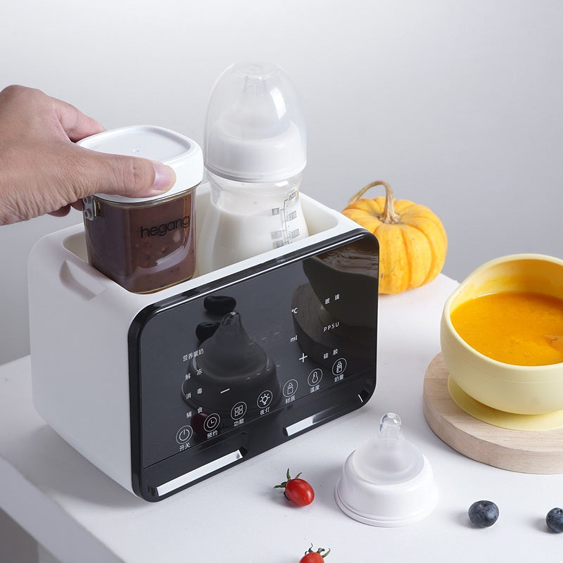 White electric baby bottle warmer with digital display, holding a milk bottle and food jar.