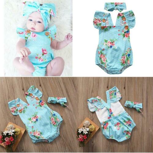 Baby girl's sleeveless blue chiffon romper with floral print and matching headband.