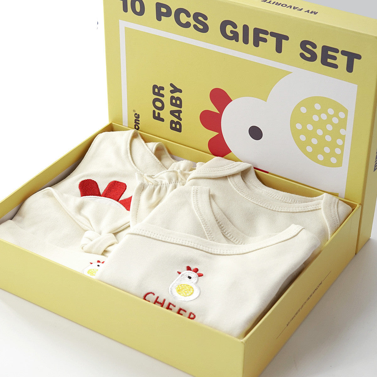 Cream 10-piece organic cotton baby gift set with chicken and chick embroidery, in a yellow box.