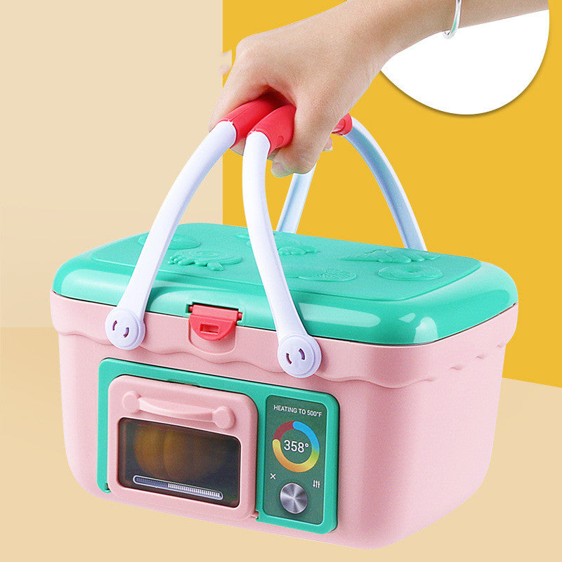 Pink and green toy kitchen set with oven and temperature display, held by a hand.