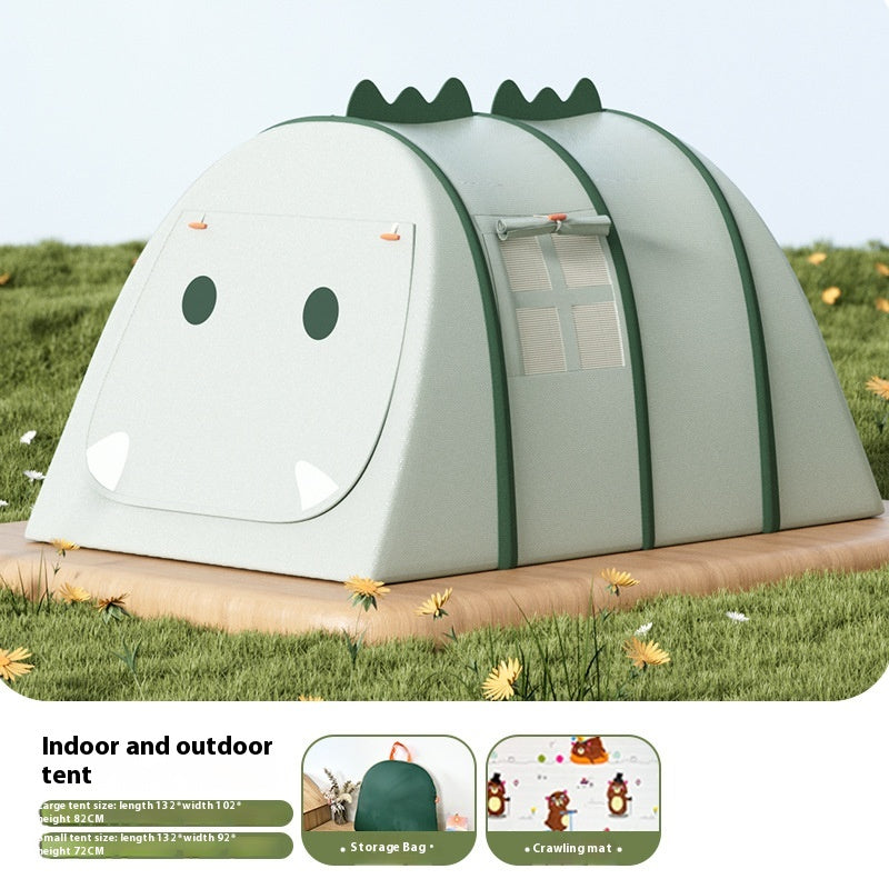 Green dinosaur-themed children's play tent with window, on a wooden base in grass.