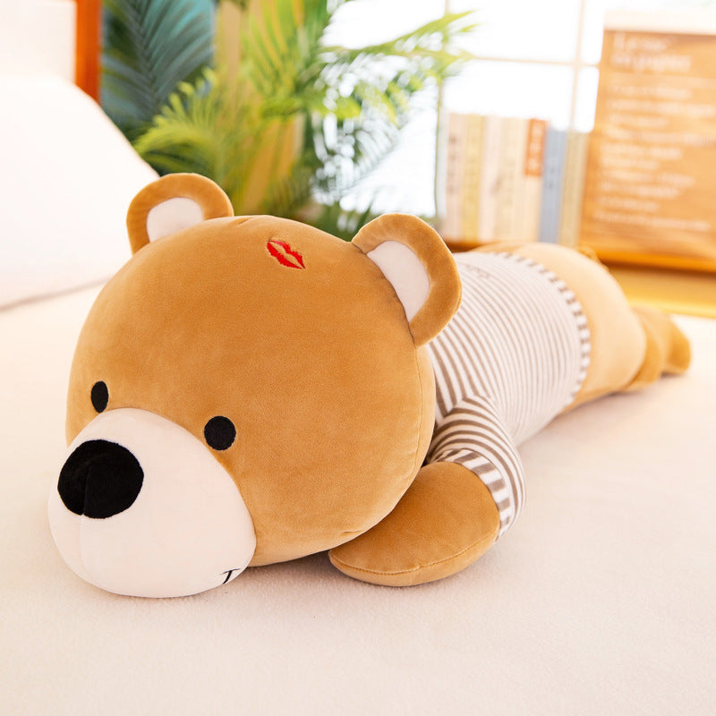 Soft brown plush teddy bear, 60cm, lying down with a striped shirt and red kiss mark.