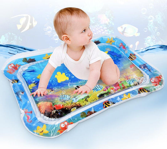 Baby on a blue inflatable water play mat with colorful floating sea creatures for tummy time.