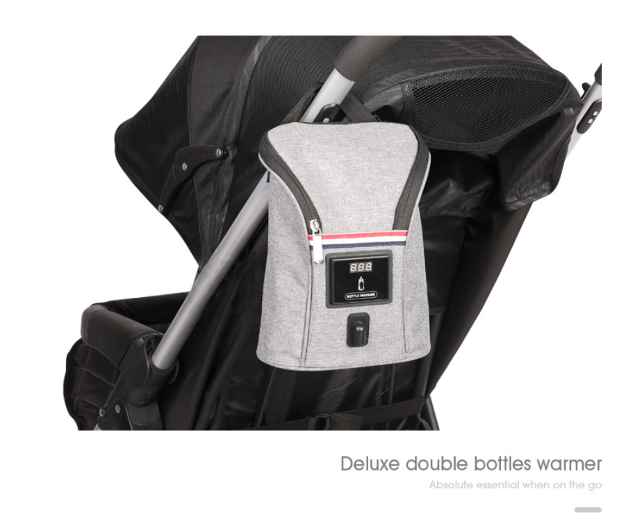 Gray portable USB car bottle warmer with digital temperature display, hanging on a stroller.