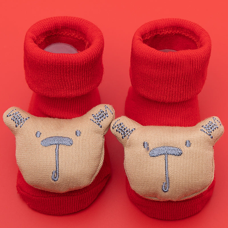 Red cotton baby socks with cute beige bear faces and anti-slip soles.