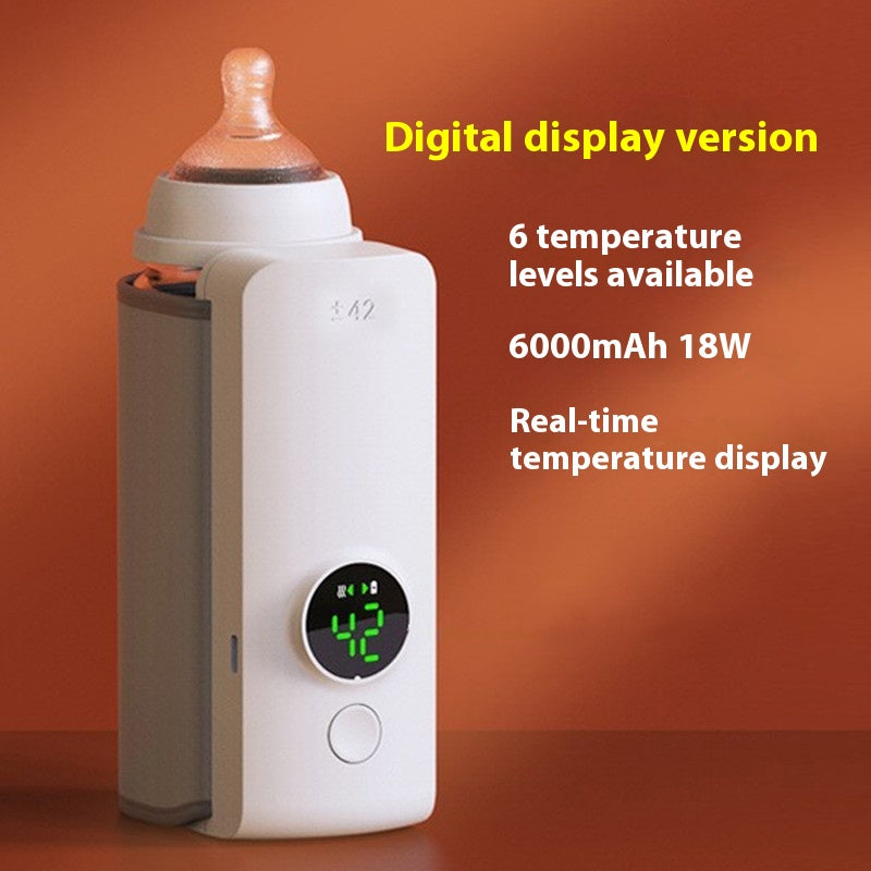 White portable USB baby bottle warmer with digital display showing "42" and a nipple.