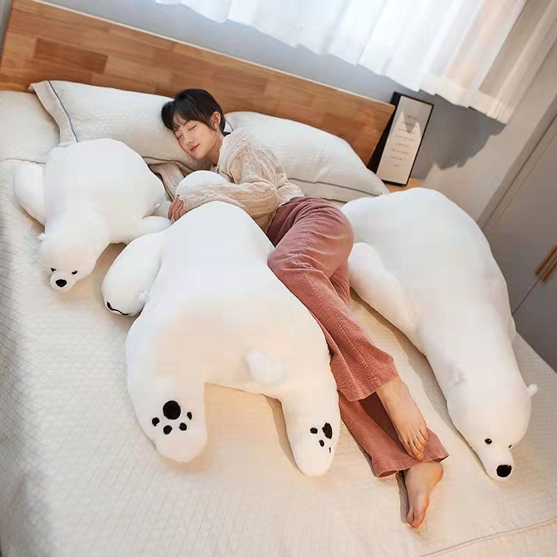 Soft white plush polar bear stuffed animal, 110cm, on a bed with a person.