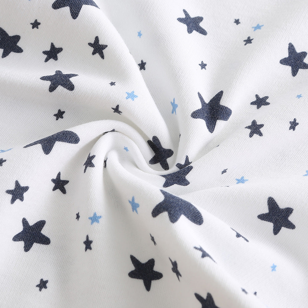 Soft white cotton baby romper fabric with dark blue and light blue star print.