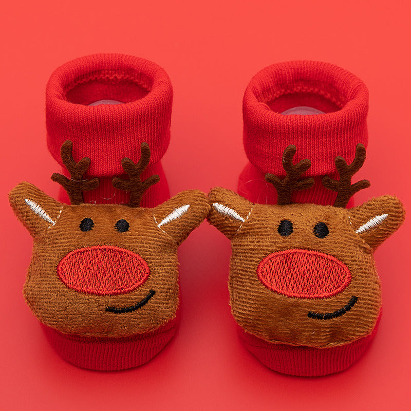 Red cotton baby socks with cute brown reindeer faces and anti-slip soles.