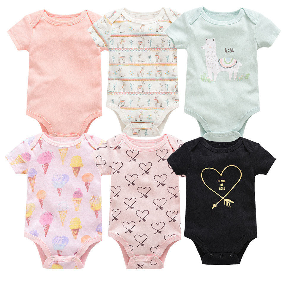 Six short-sleeve cotton baby bodysuits in various colors and patterns: pink, white with llamas, mint green with a llama, pink with ice cream cones, pink with hearts, and black with a "Heart of Gold" design.