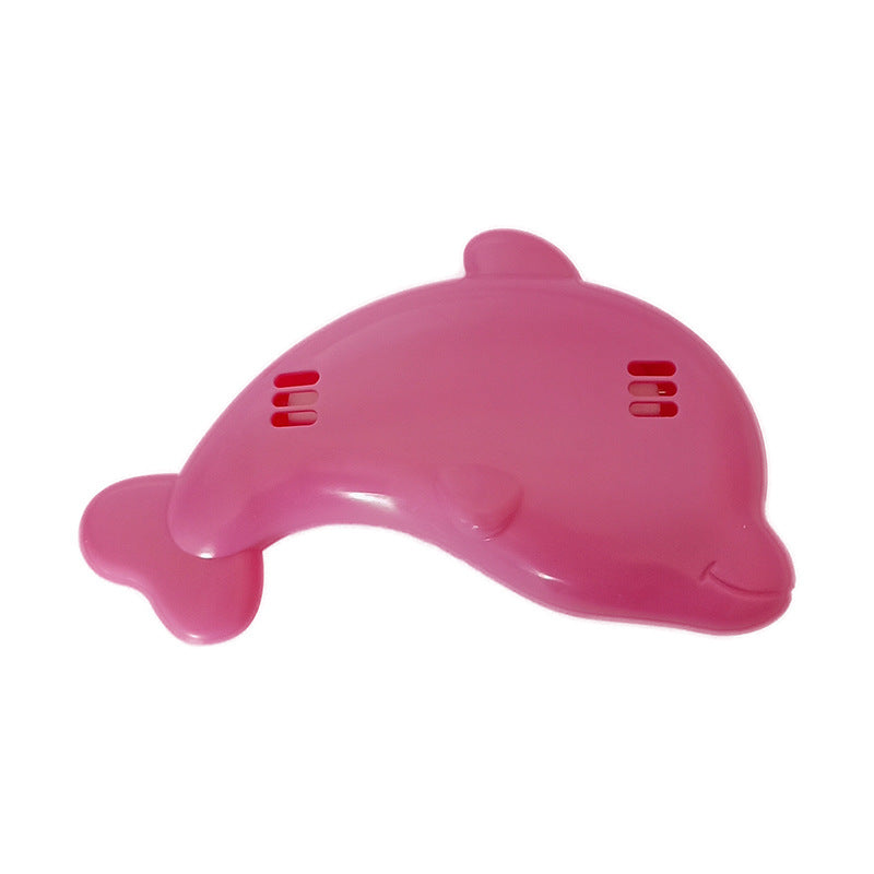 Pink plastic dolphin-shaped baby bath thermometer with a smiling face and vent details.