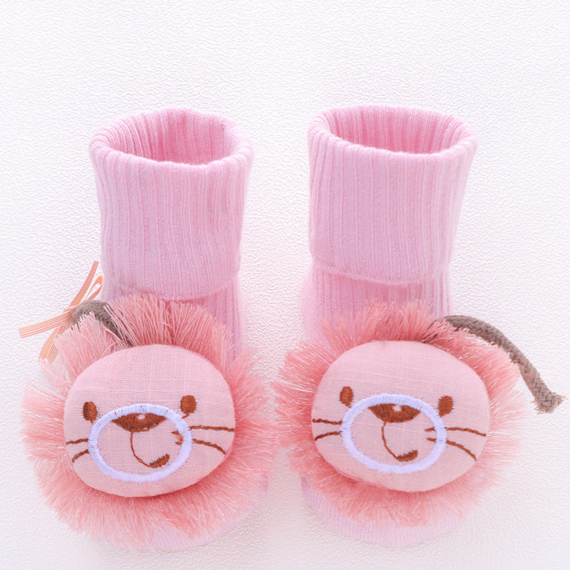 Pink cotton baby socks with cute lion faces and anti-slip soles.
