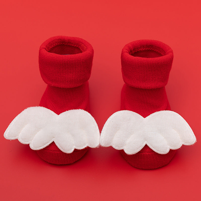 Red cotton baby socks with white angel wings and anti-slip soles.