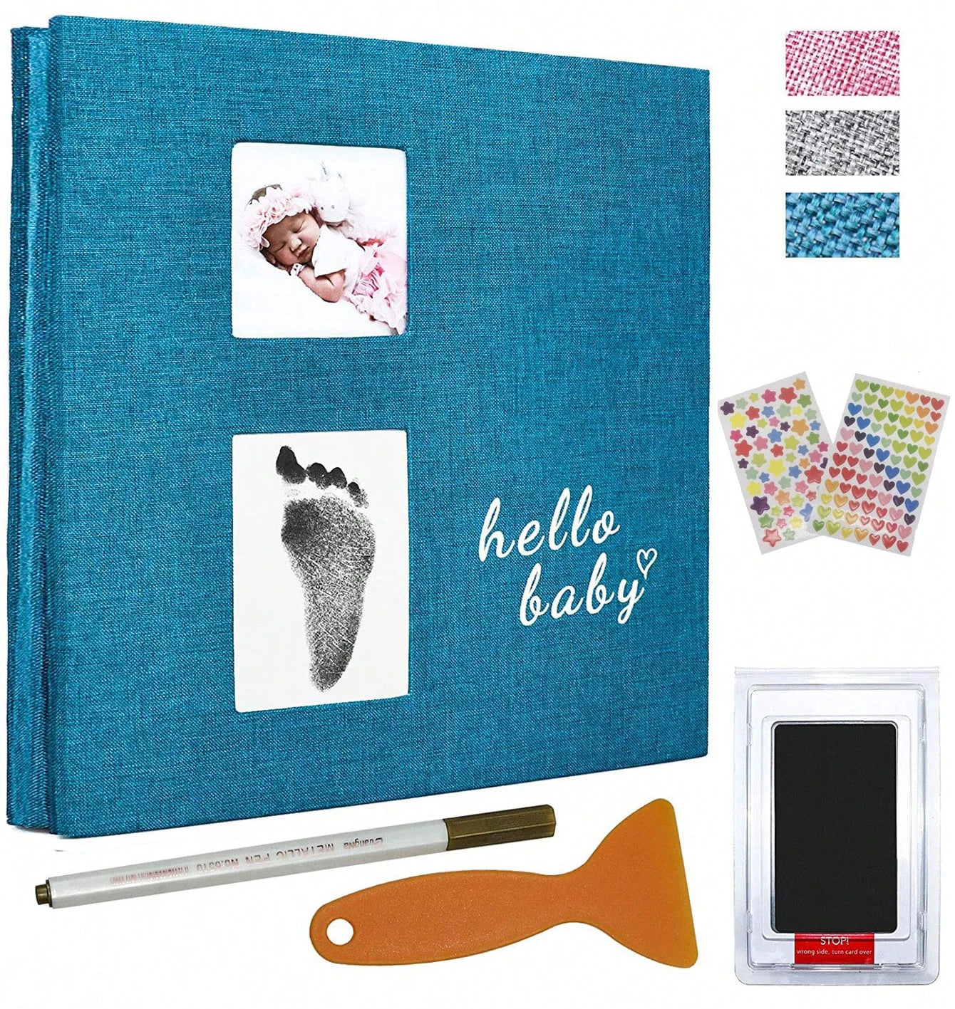 Teal linen baby photo album with "hello baby" text, baby photo, footprint, ink pad, pen, and scraper.