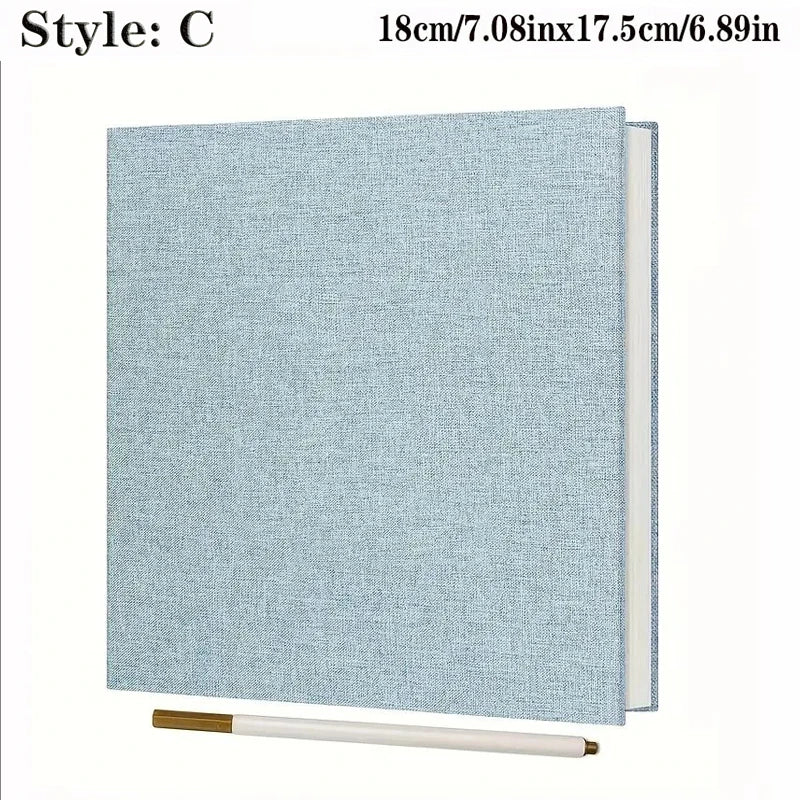 Light blue linen fabric photo album with spiral binding, 18x17.5cm, and a white marker.