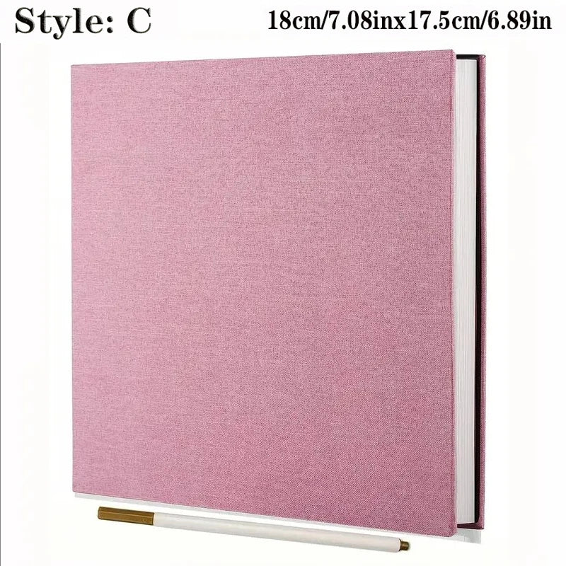 Pink linen self-adhesive photo album with spiral binding, 18cm x 17.5cm, with a gold pen.
