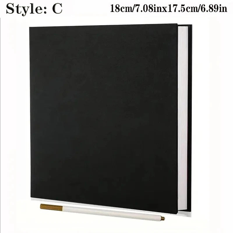 Black linen self-adhesive photo album with a spiral binding, shown with a gold pen.