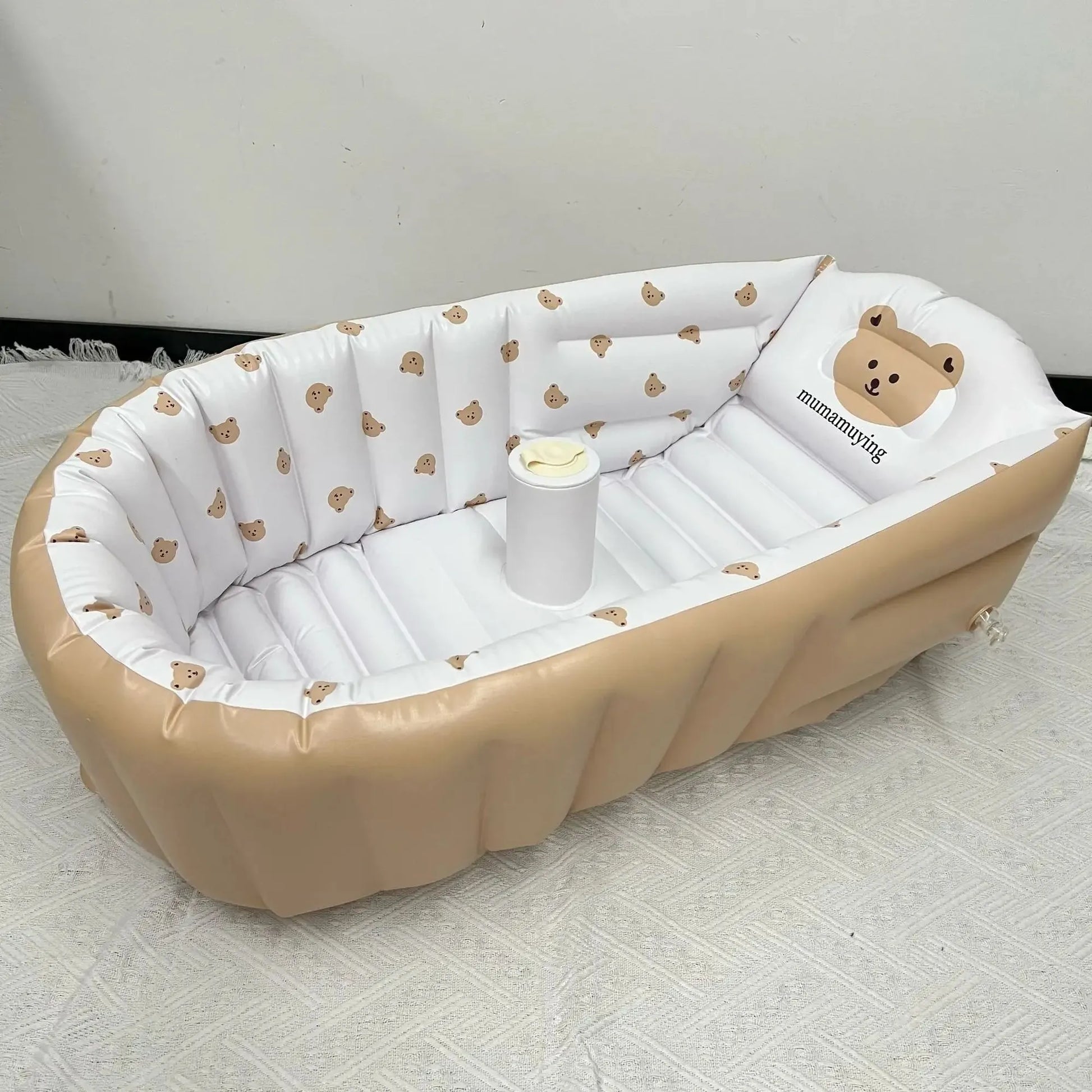 Portable inflatable baby bathtub with built-in pump, featuring a cute bear design and soft PVC material.