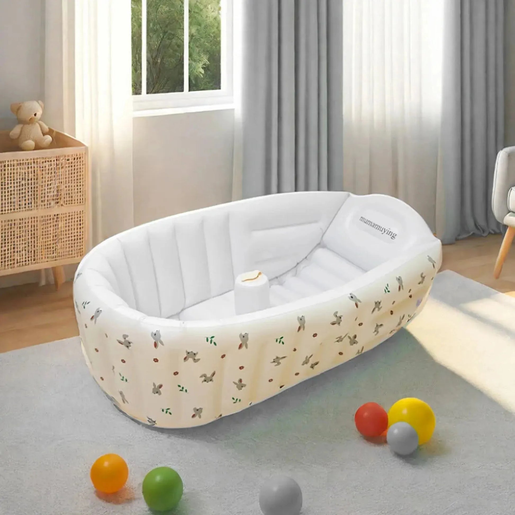 Portable white inflatable baby bathtub with animal print, built-in pump, and soft PVC material.