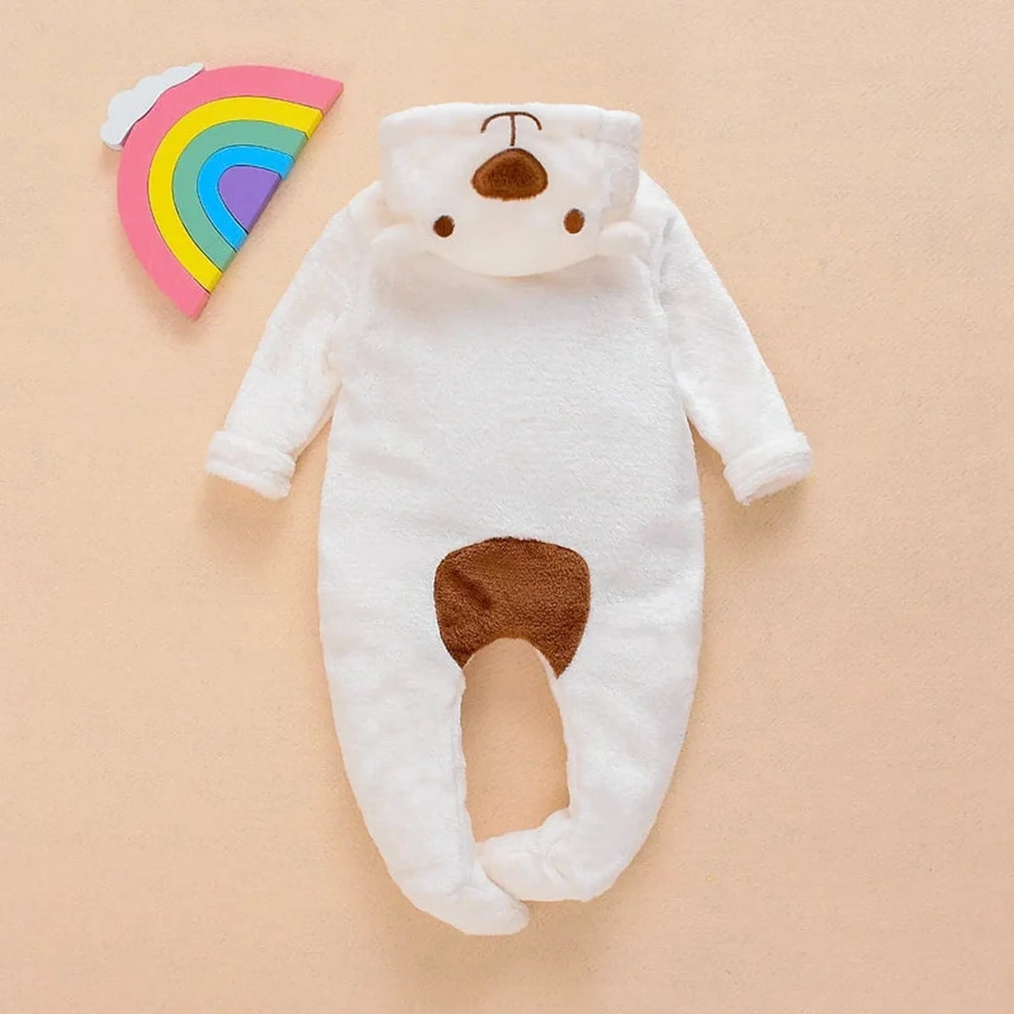 White plush baby bear hooded romper with brown nose and belly patch.
