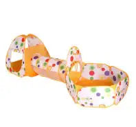 Orange 3-in-1 kids' play tent with tunnel and ball pit, featuring colorful polka dots.