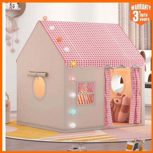 Pink and white checkered playhouse tent for kids with windows and an open door, on a colorful rug.