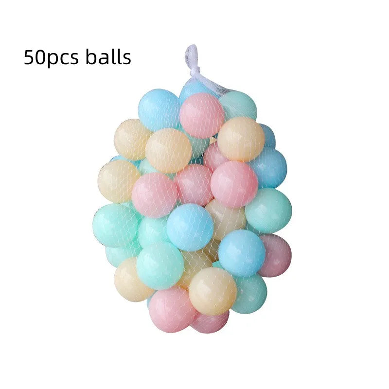 Mesh bag of 50 colorful pastel plastic play balls in pink, blue, yellow, and green.