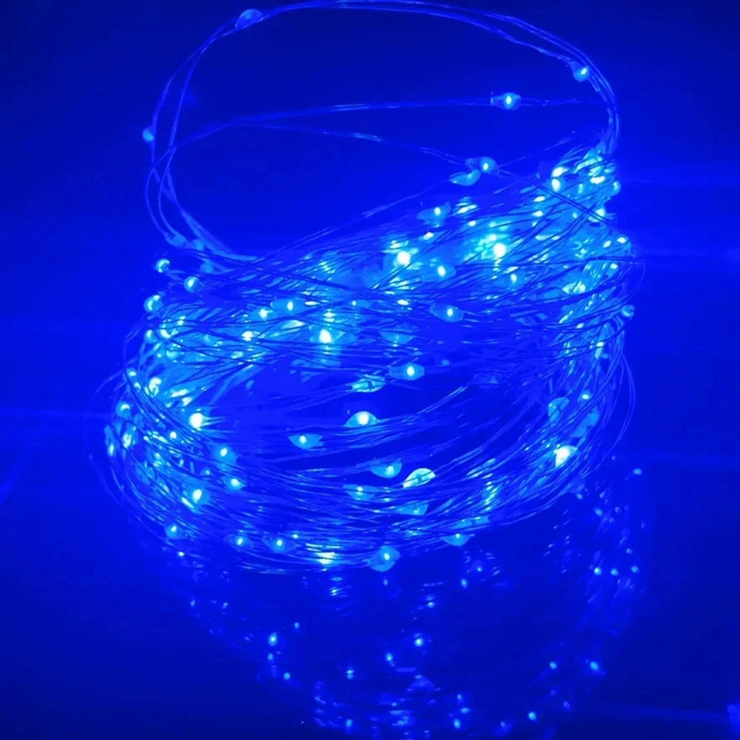 Coiled blue LED string lights with small, bright bulbs, ideal for room decor.